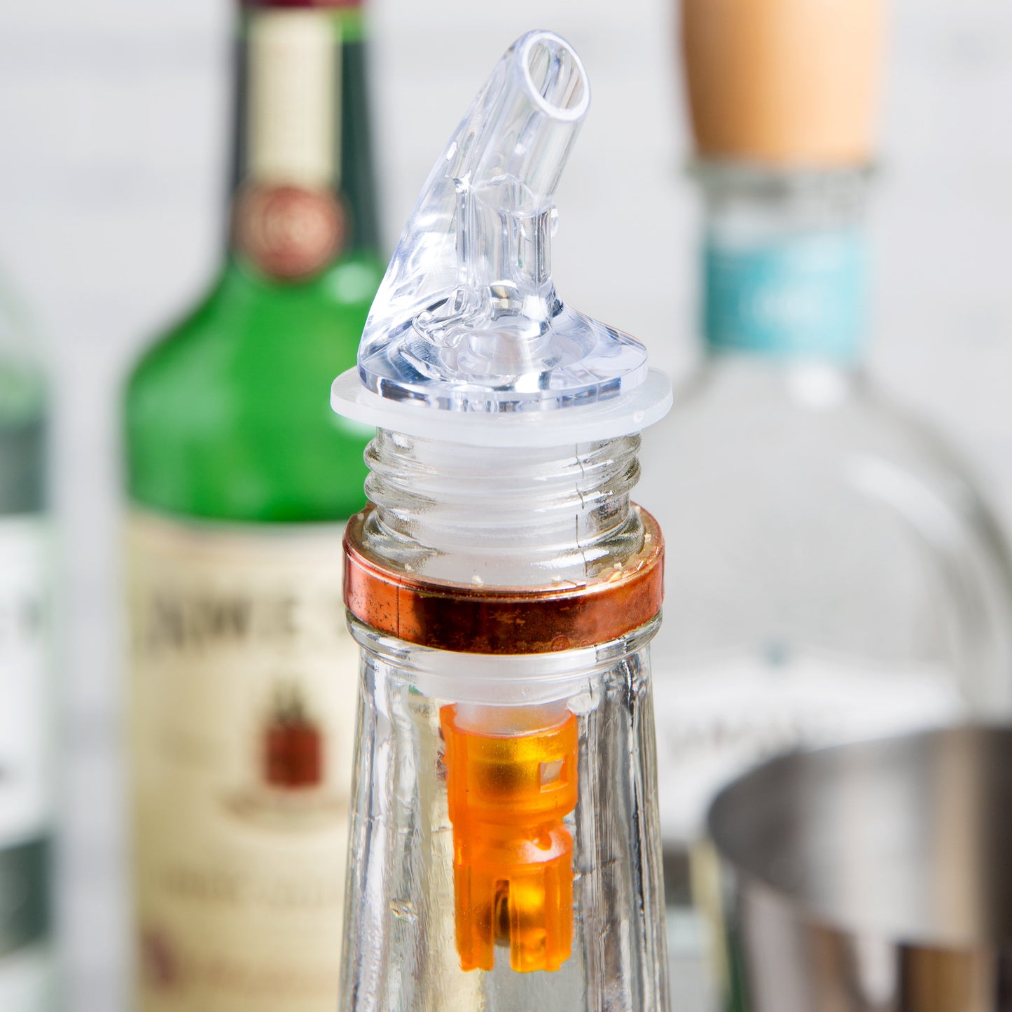 .5 OZ. CLEAR SPOUT / ORANGE TAIL MEASURED LIQUOR POURER WITHOUT COLLAR - 12/PACK